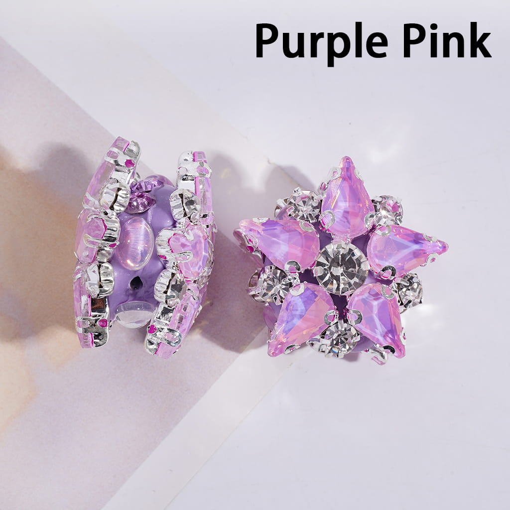 Purple and pink star-shaped earrings on a light background