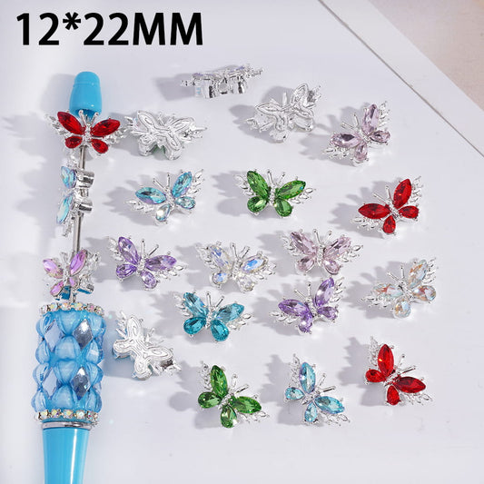 Colorful butterfly-shaped jewelry components on a white background with '12*22MM' text.