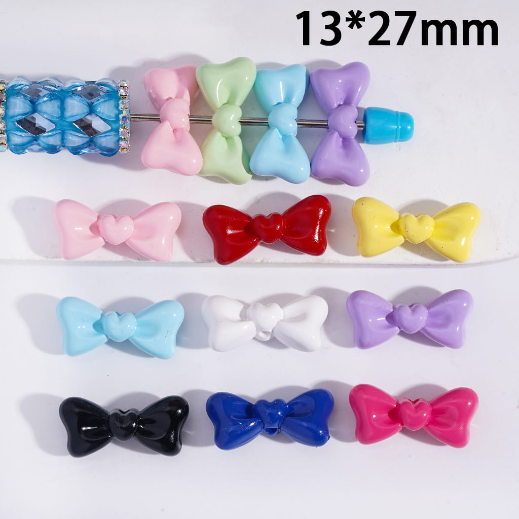 Colorful bow-shaped hair clips on a white background with size indication.