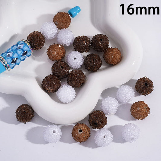 Assorted brown, white, and blue beads on a white surface with '16mm' text.