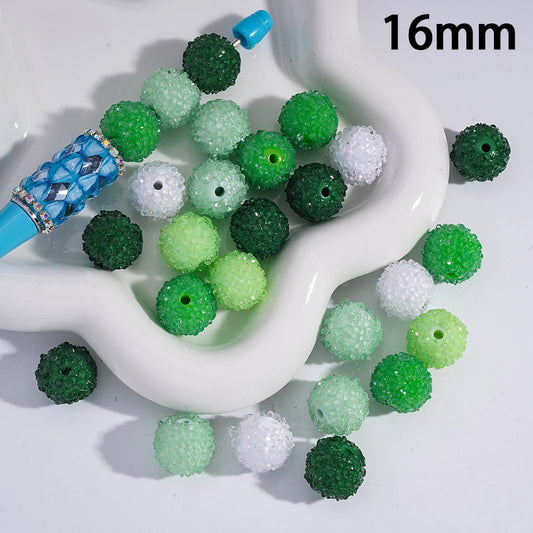 Green and white beads on a white dish with '16mm' text