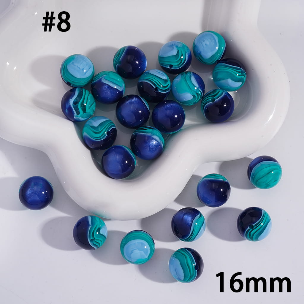 Blue and green marbled beads on a white dish with '16mm' text.