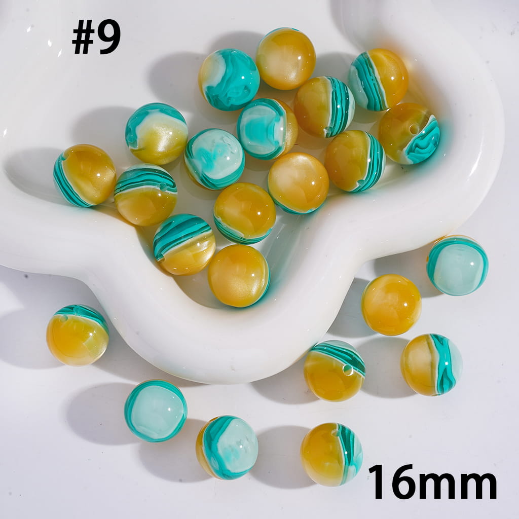 Multicolored beads on a white dish with '16mm' text