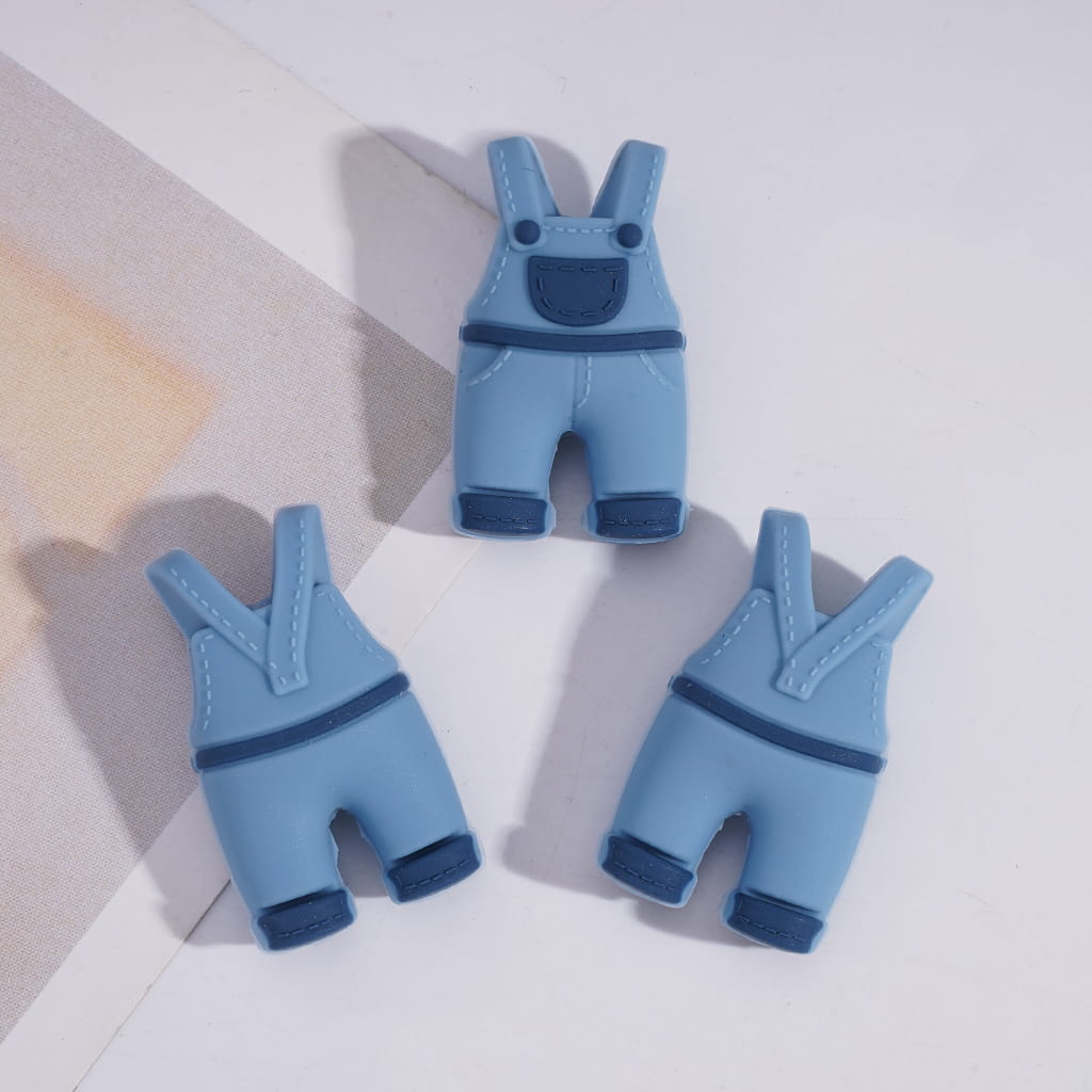 Blue baby overalls on a light gray background