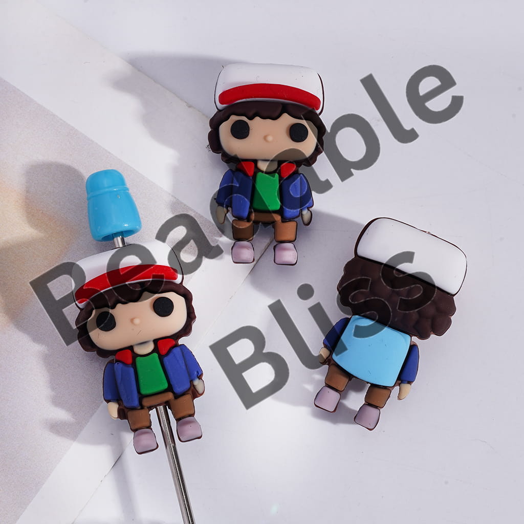Two cartoon-style figurines with colorful outfits on a white background