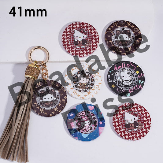 Set of keychains and coasters with cartoon character design on a white background