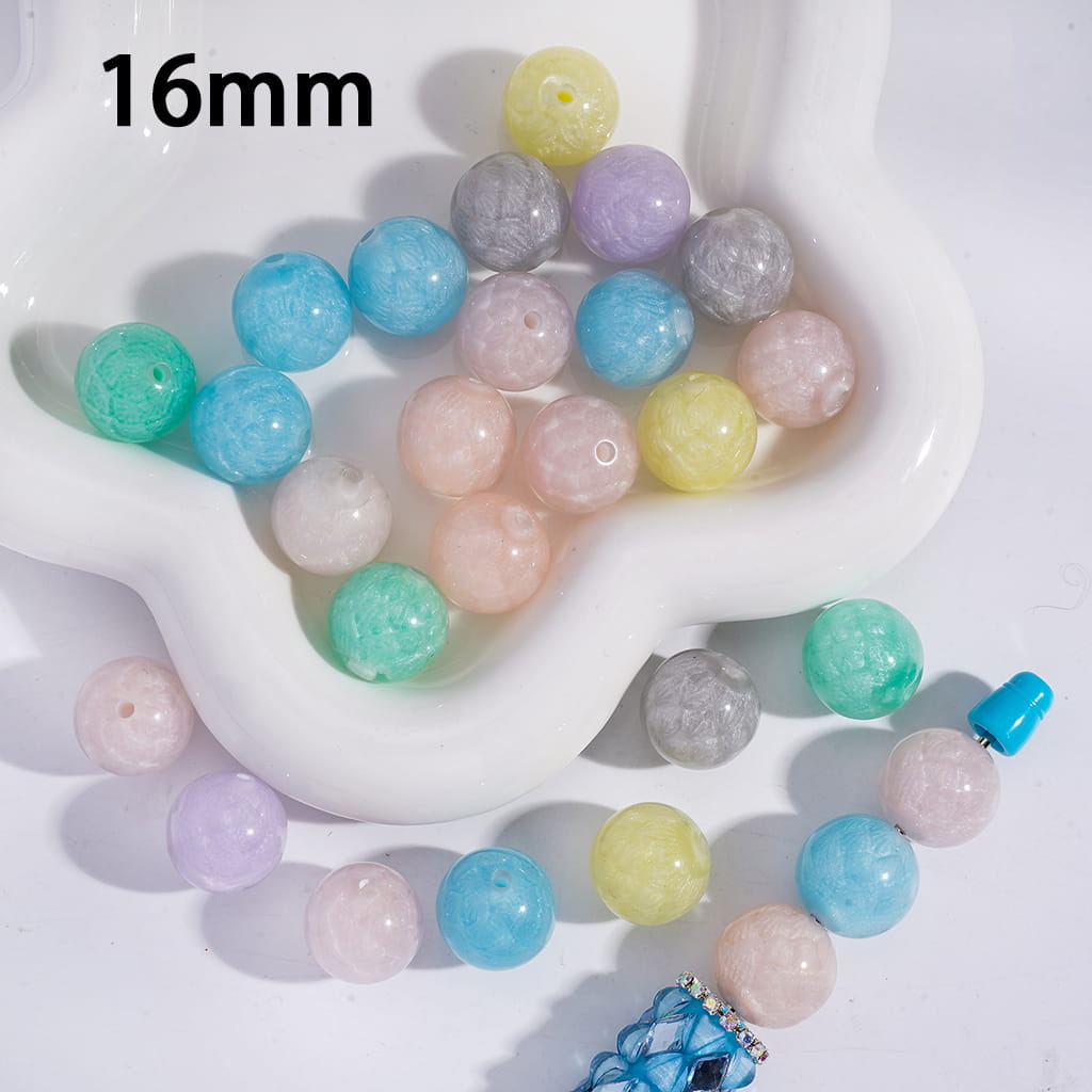 Assorted colored beads on a white dish with '16mm' text.