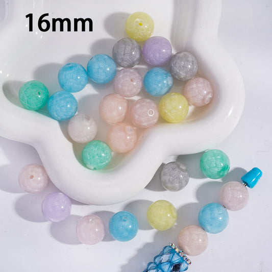 Assorted colored beads on a white dish with '16mm' text.