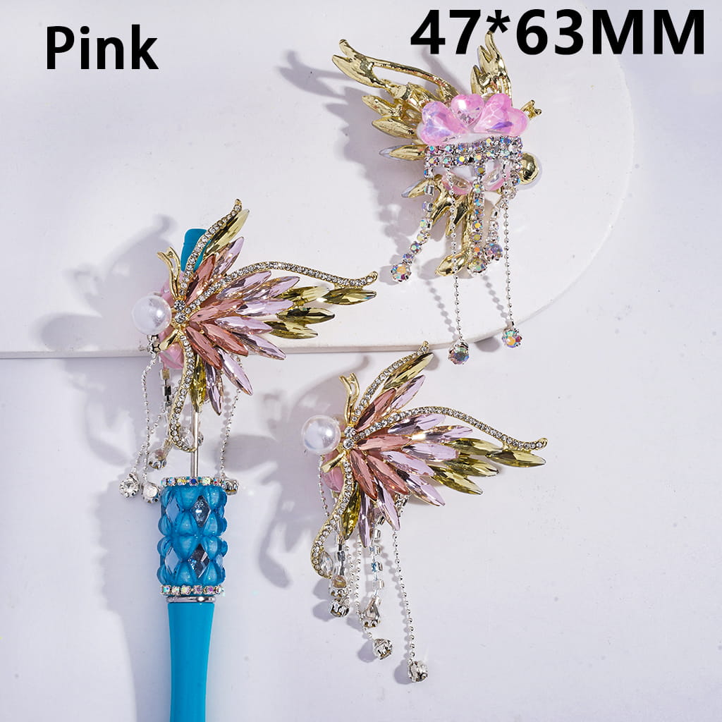 Decorative hair sticks with pink and gold design on a white background