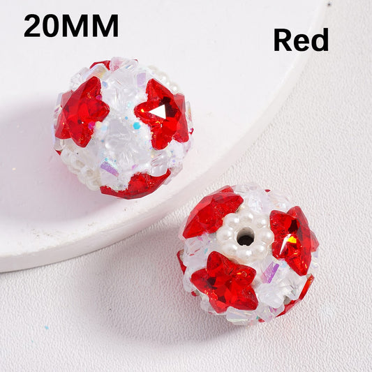 Red and white beads with star patterns on a white background

