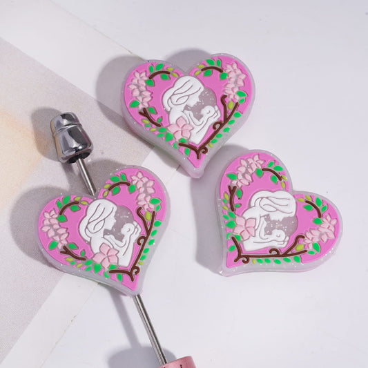 Silicone Focal Beads with Mom Holding Baby Surround by Flower and Leaf Garland, Silver Glitter, Flat Heart Shape