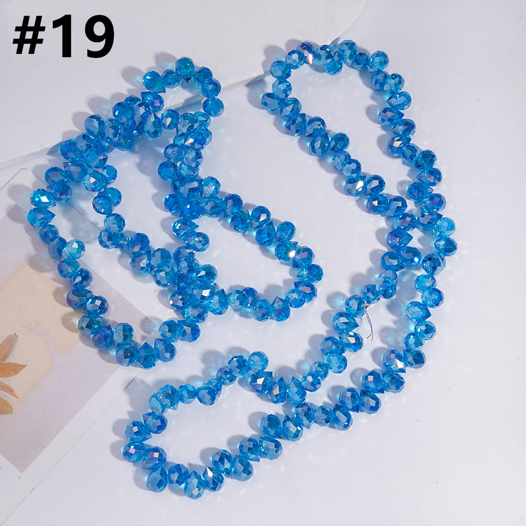 Blue beaded necklace on a white background


