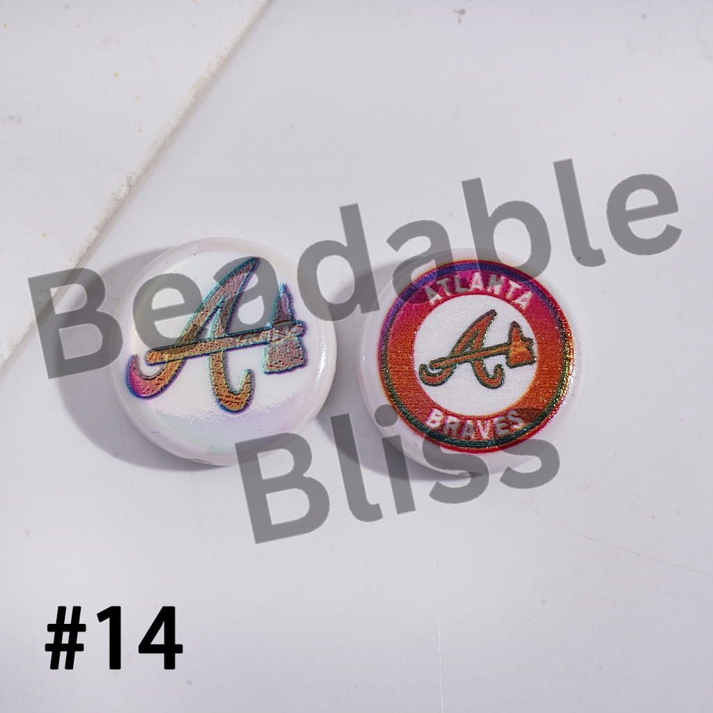 Two Atlanta Braves pins on a white background with 'Beadable Bliss' branding.

