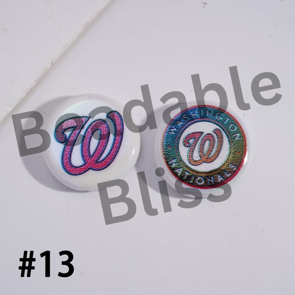 Two round pins with a logo and 'Washington Nationals' text on a white background with 'Bodable Bliss' branding.

