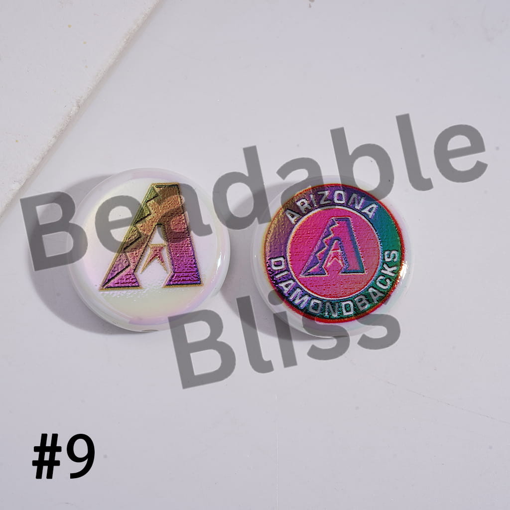 Two colorful pins with logos on a white surface with 'Bendable Bliss' branding.

