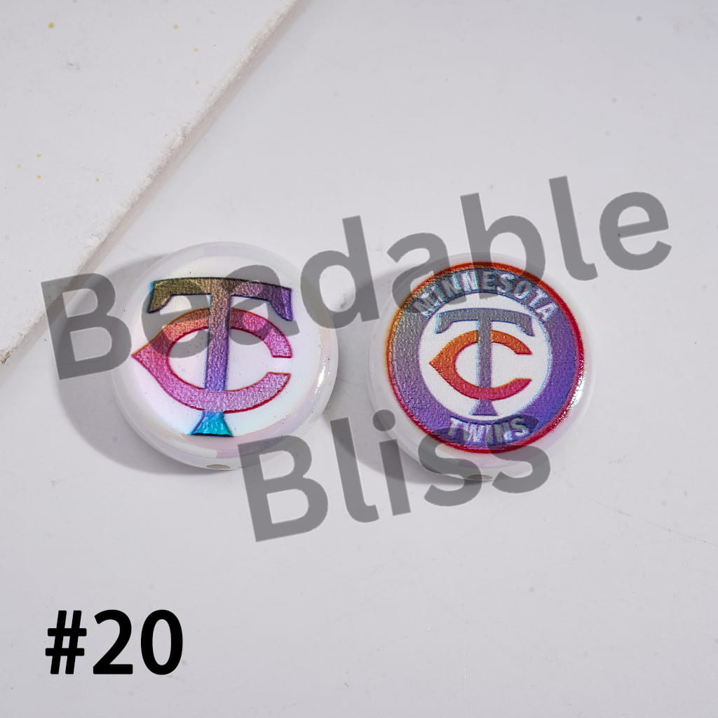 Two decorative pins with colorful designs on a white background, featuring the text 'Bendable Bliss' and '#20'.

