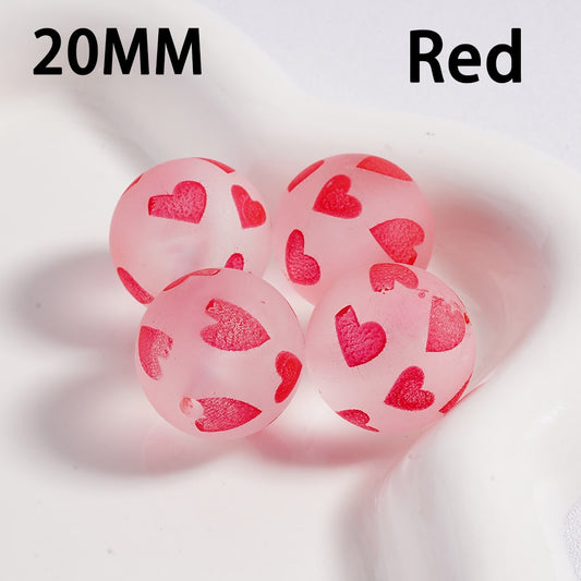 Pink beads with red heart patterns on a white background, labeled '20MM Red'.

