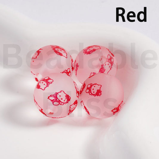 Pink marbles with Hello Kitty designs on a white background

