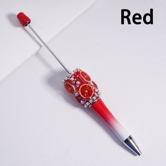 Decorative pen with red and white design on a light gray background

