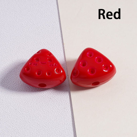 Two red triangular beads on a white background with 'Red' text.

