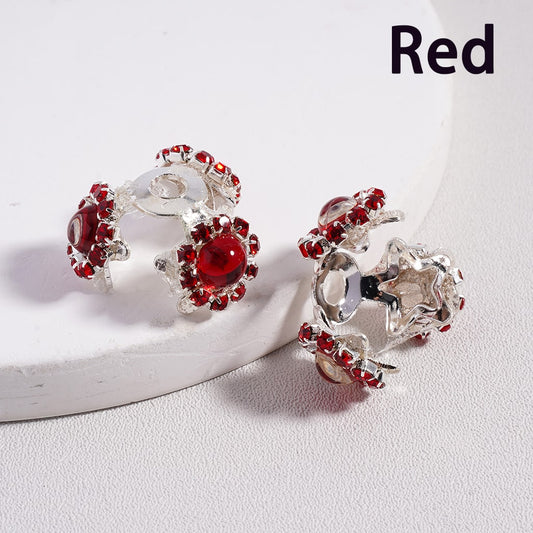 Red and silver earrings on a white background with 'Red' text.

