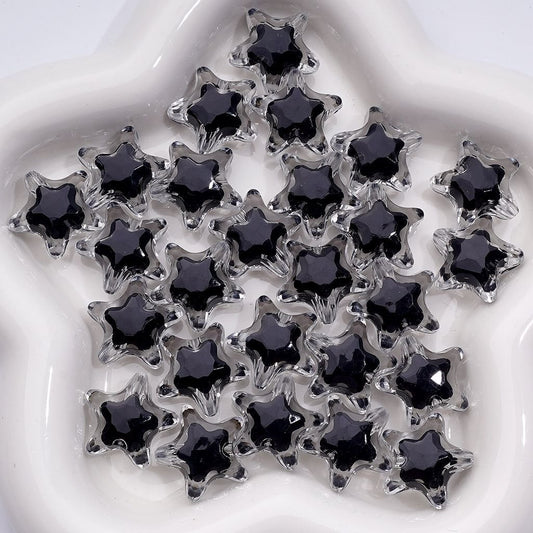 Star-shaped black stones on a white background

