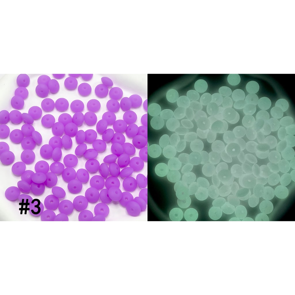 Purple beads on the left and green glow-in-the-dark beads on the right.

