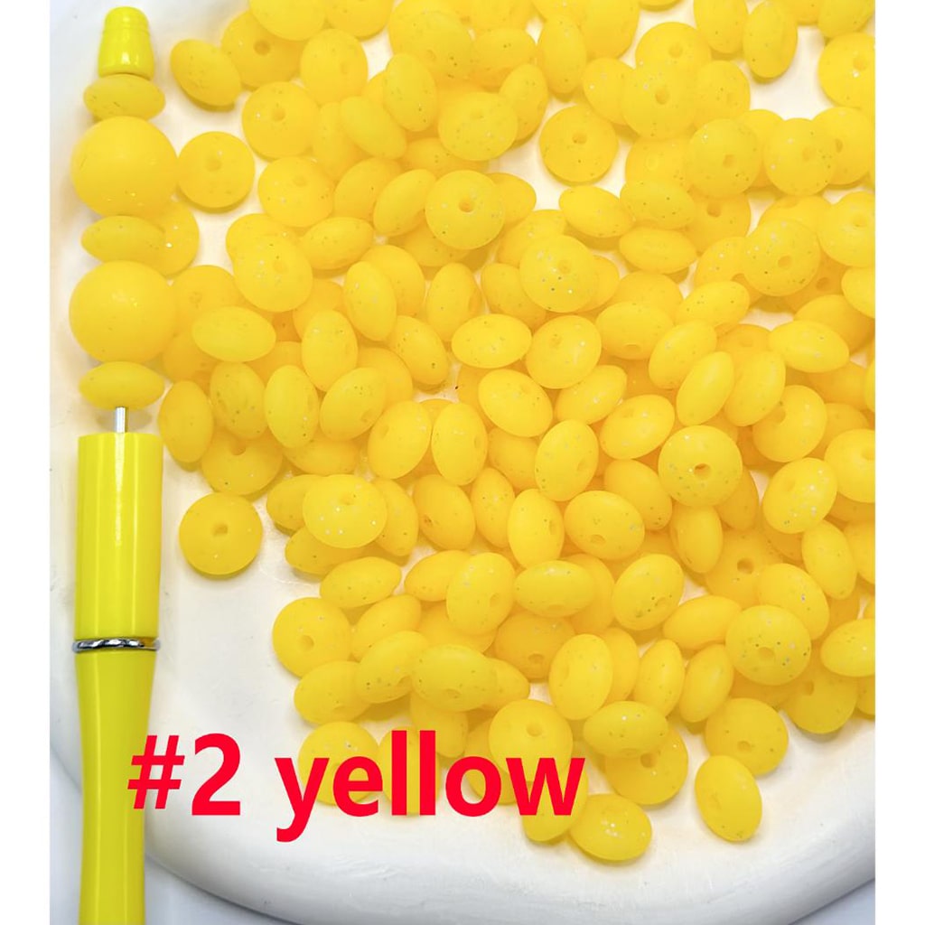 Yellow beads and a yellow pen on a white background with '#2 yellow' text.

