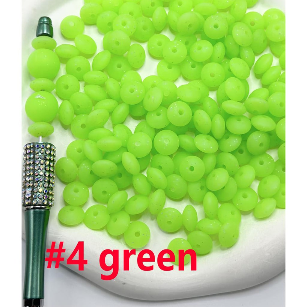 Green beads with a pen labeled '#4 green' on a white background

