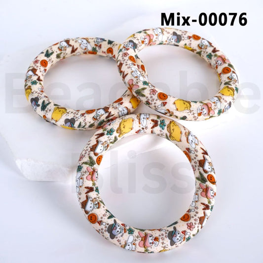 Three floral-patterned bangles on a white background

