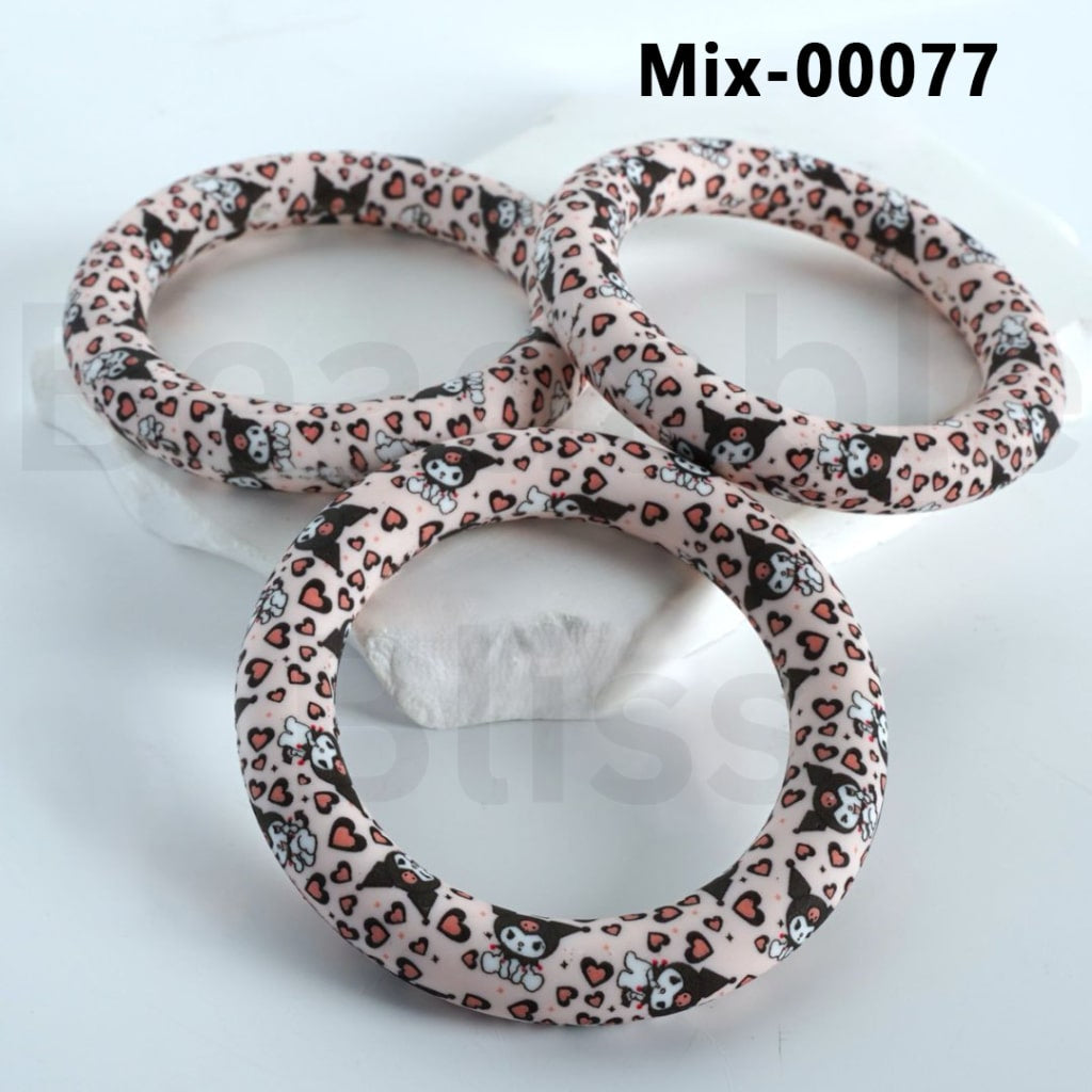 A set of silicone ring frames with a pattern of Kuromi and other characters from Sanrio.


