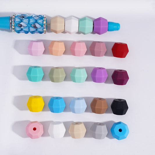 Colorful geometric bead holder with various colored beads on a white background