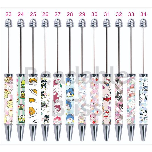 Set of pens with colorful cartoon character designs on white background

