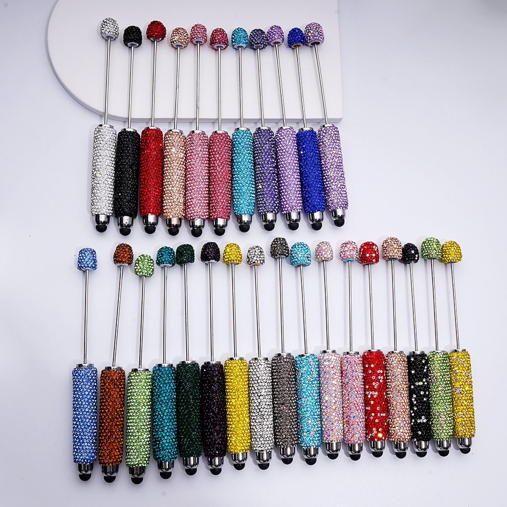 Set of colorful beaded sticks on a white background

