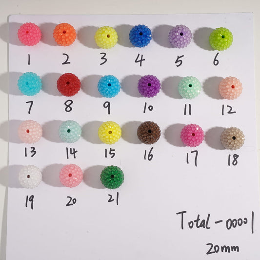 Assorted colorful beads on a white card with numbers

