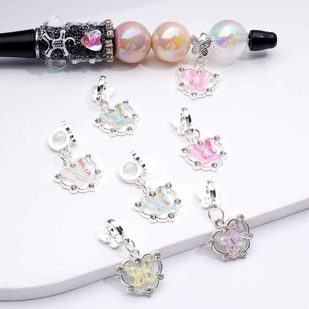 Set of colorful heart-shaped charms on a white background


