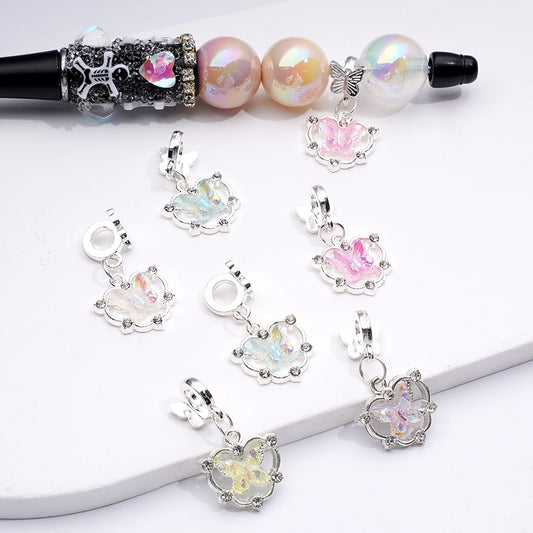 Set of colorful heart-shaped charms on a white background

