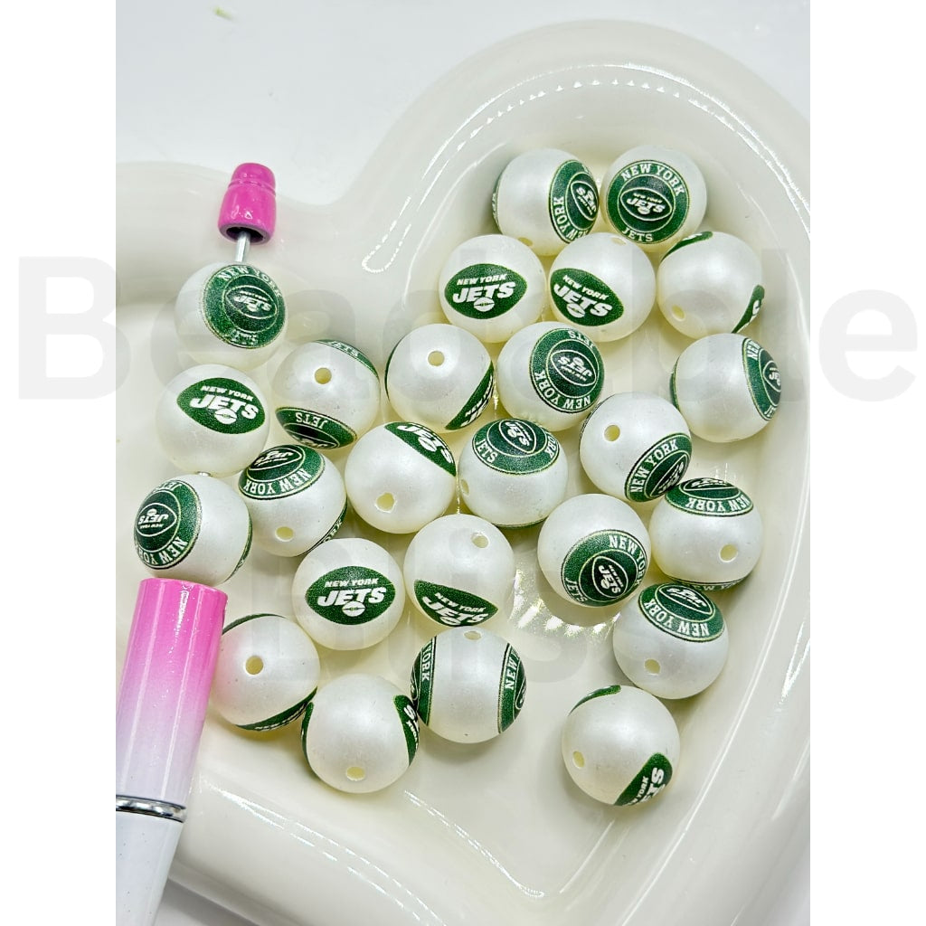 White fishing lures with New York Jets logo on a white tray

