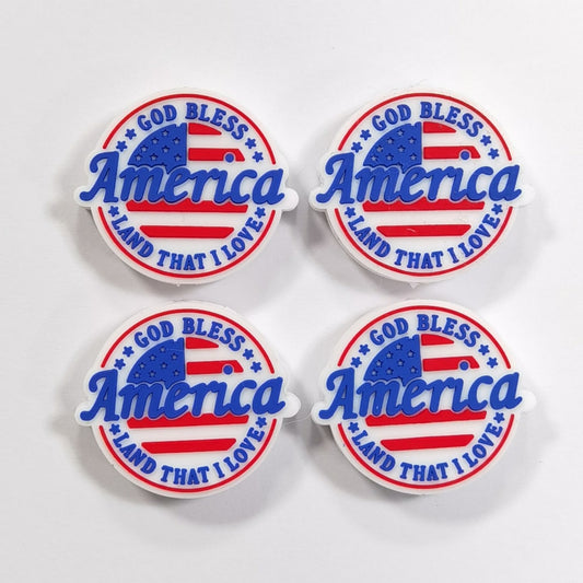 A set of silicone beads with the inscription 'God Bless America' and the American flag colors.

