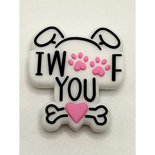 A silicone focal bead featuring a dog paw design with the phrase 'I Woof You' written on it. The background is white, with black lettering and pink accents.

