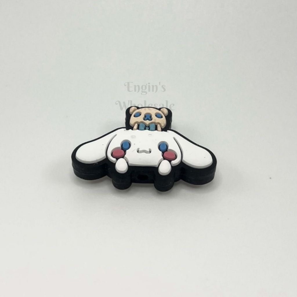 Panda-shaped keychain with colorful accents on a white background

