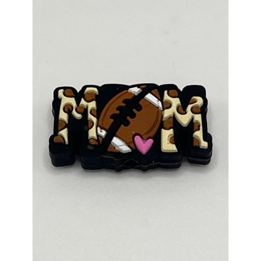 A silicone focal bead featuring a jaguar print design with the text 'MOM' and a football and heart motif.

