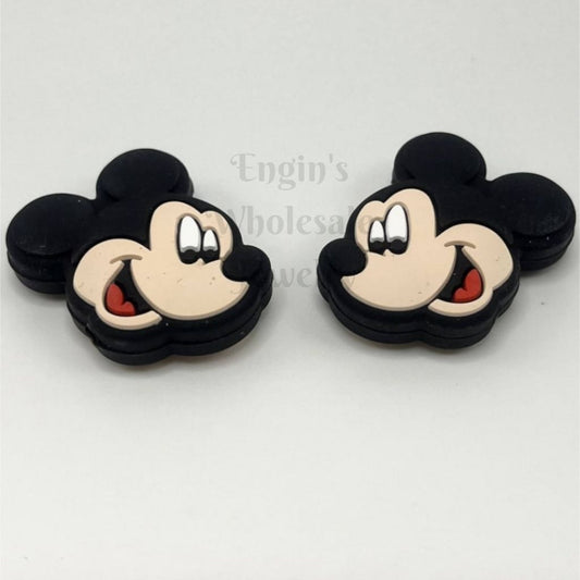 Two black and beige Mickey Mouse earrings on a white background

