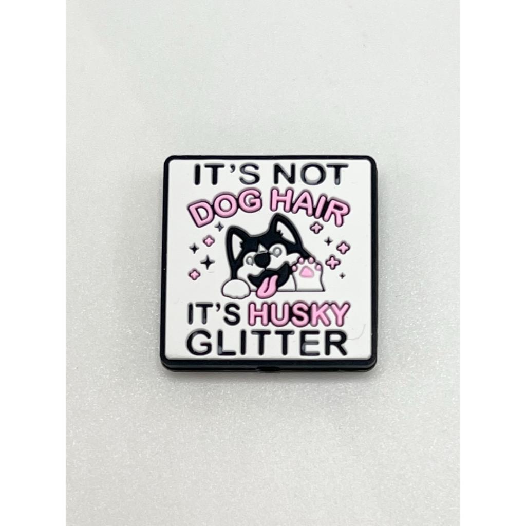 A silicone focal bead with an image of a dog and the text 'It's Not Dog Hair It's Husky Glitter' on a white background.

