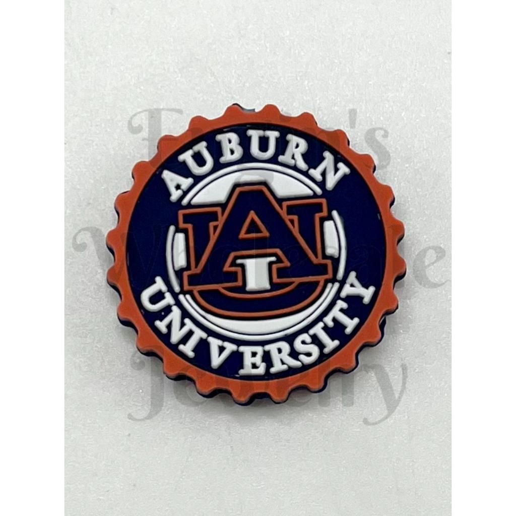 Auburn University logo on a bottle cap-shaped badge

