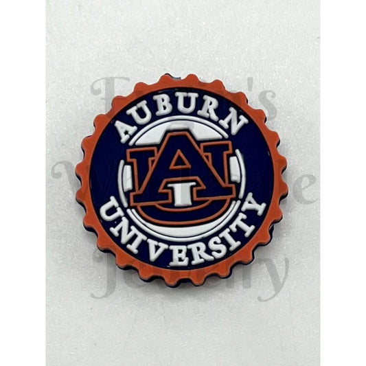 Auburn University logo on a bottle cap-shaped badge

