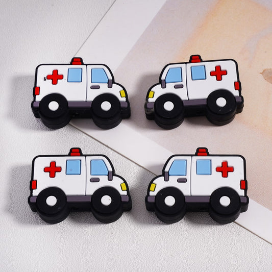 Four toy ambulance figures on a light background

