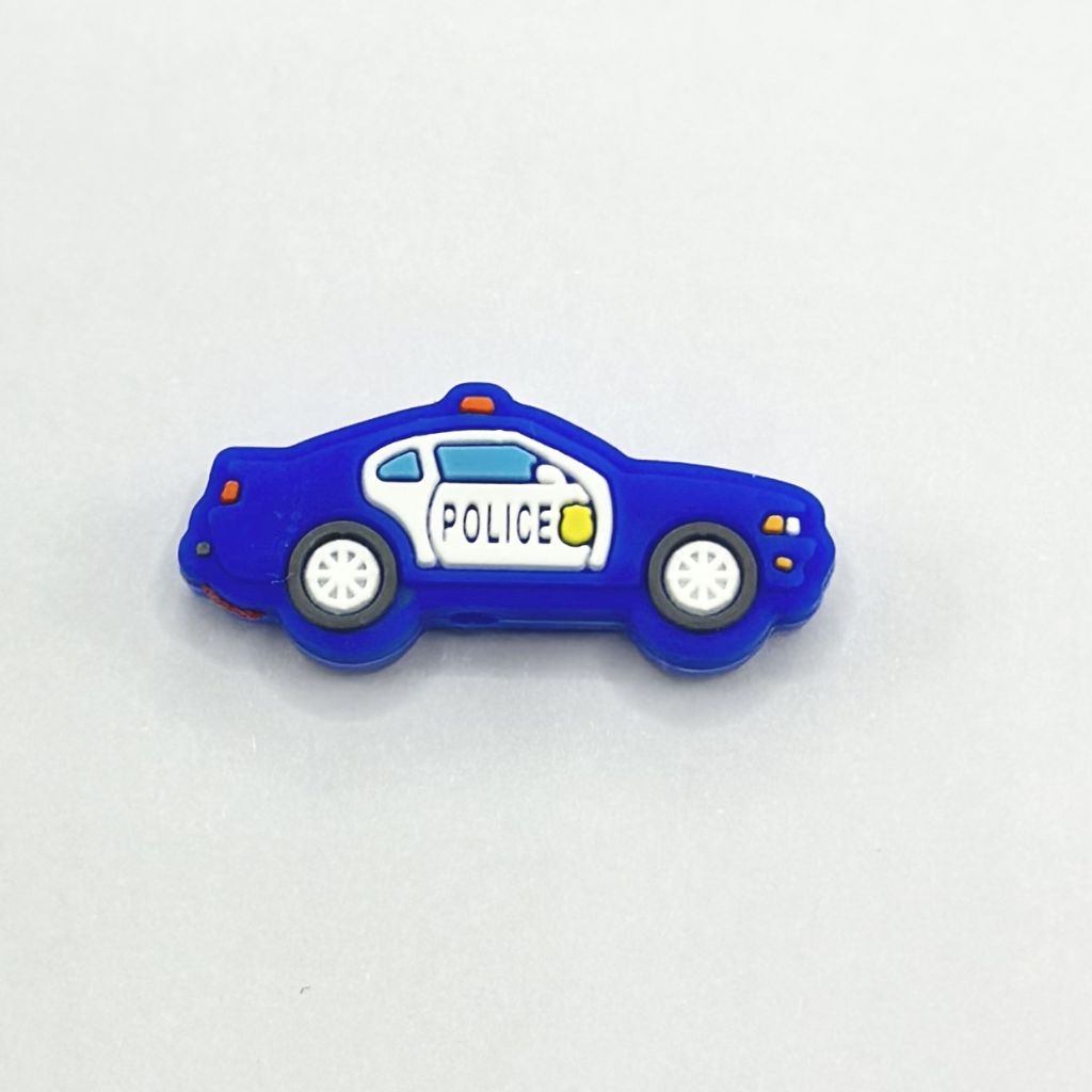 A blue silicone bead shaped like a police car vehicle.

