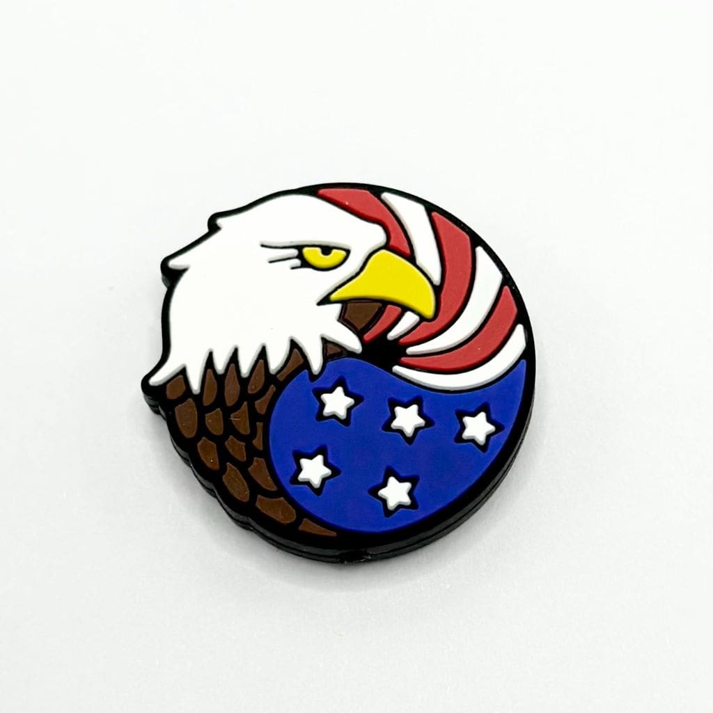 A round silicone bead featuring a patriotic design with an eagle and stars, predominantly in red, white, and blue colors.

