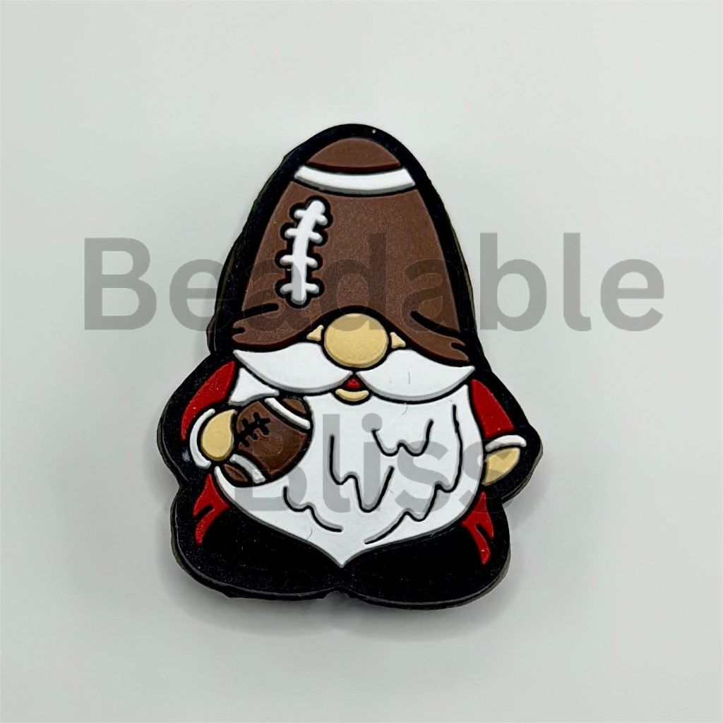 Gnome-shaped pin with football helmet and ball on a white background

